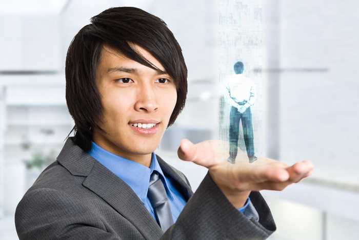 Businessman holding an hologram in his hand